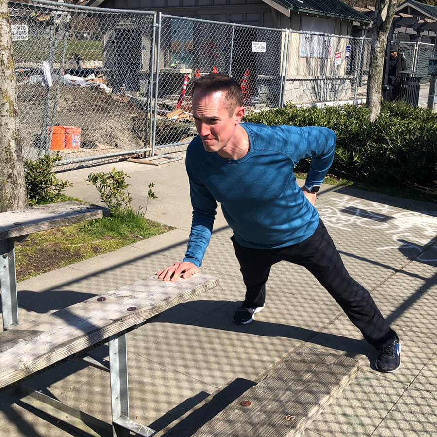 David doing one-handed push-ups with his determined face on.