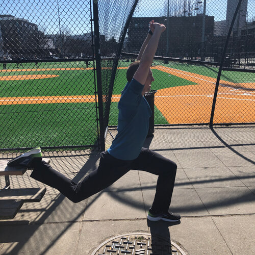 David lunges off bleachers at the park.