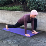 David doing yoga outside on concrete