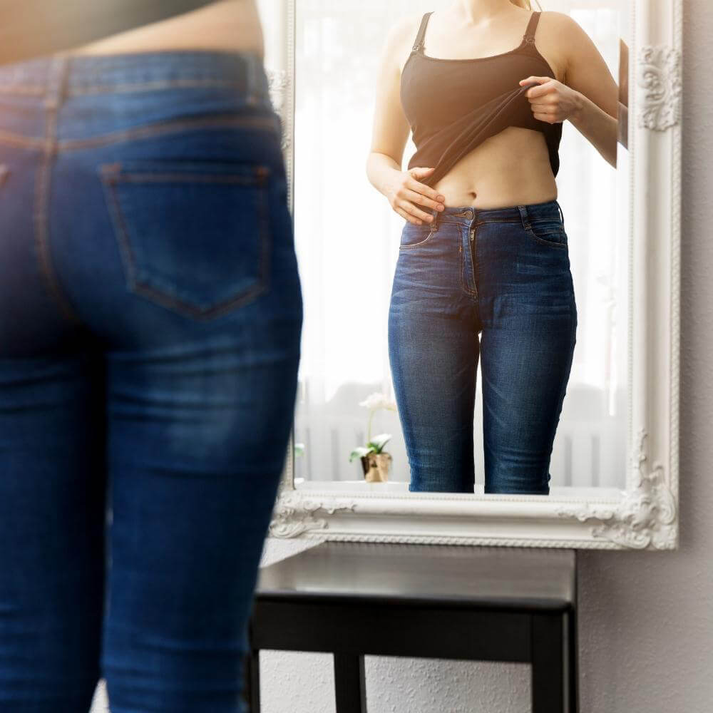 woman looking at herself in the mirror